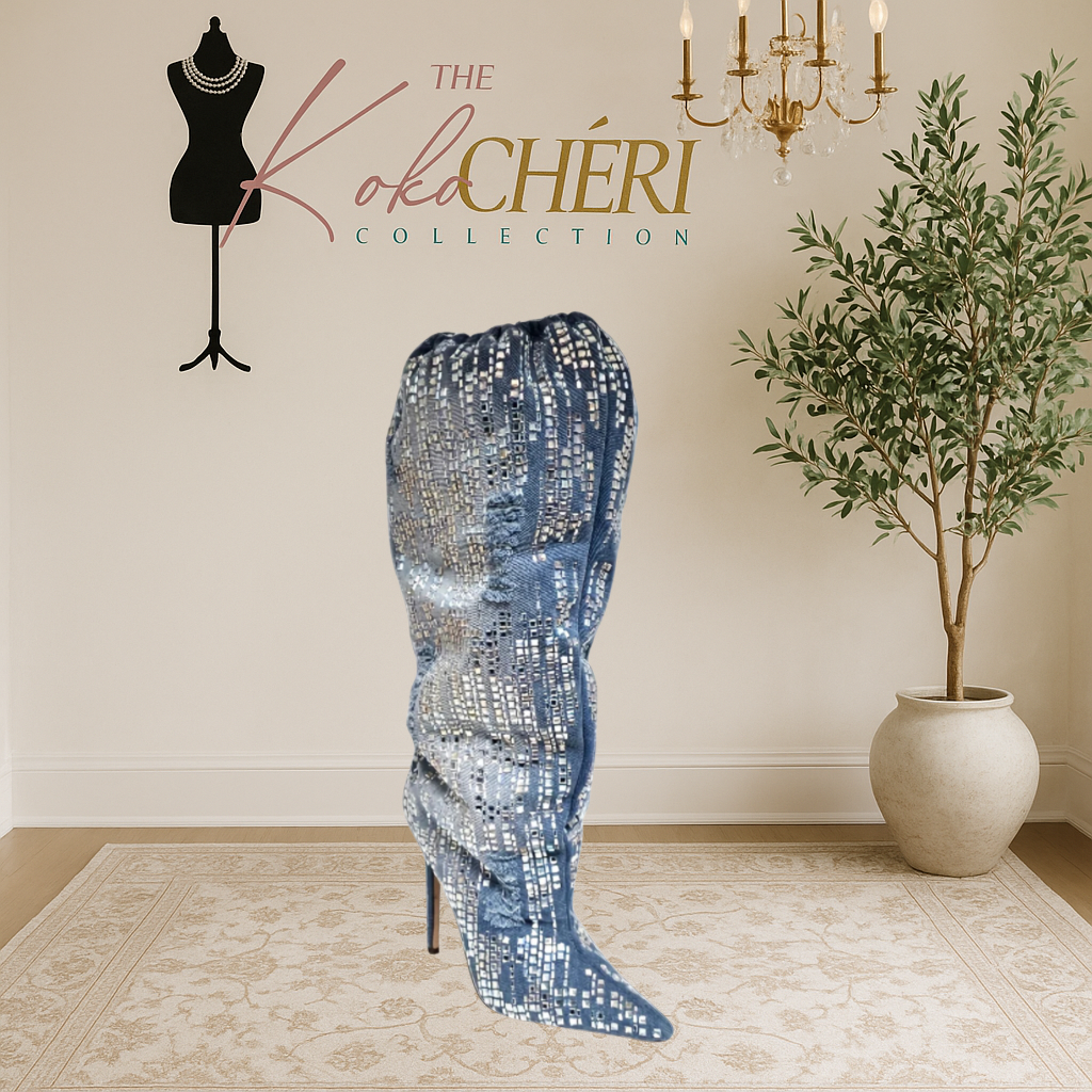 Blue sequin boot on a mannequin with 'The Koki Chéri Collection' branding, indoor setting with plant and chandelier.